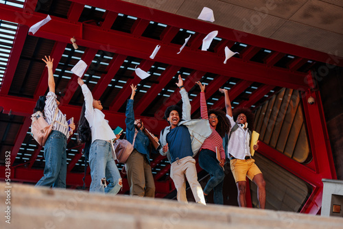 Excited students university graduation.