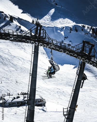 Vertical shot of a ski lift in the Alps