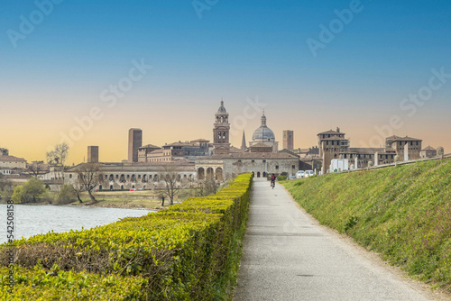 The famous cityscape of Mantua from the bridge over the Mincio at sunset