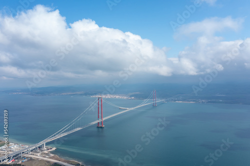 Aerial view of Hellespont and new made 1915 canakkale bridge and high way with white clouds and ships on the sea