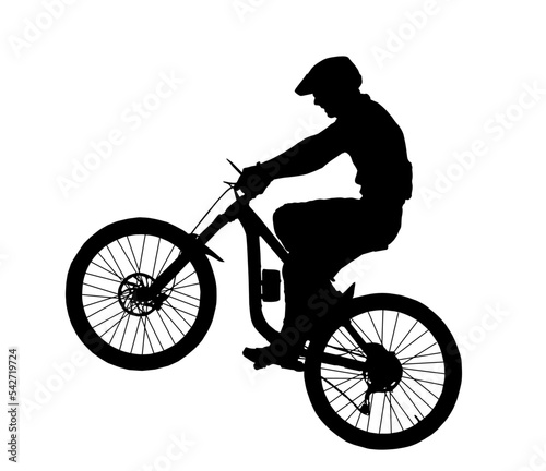 Detailed silhouette of mountain bike rider popping wheelie