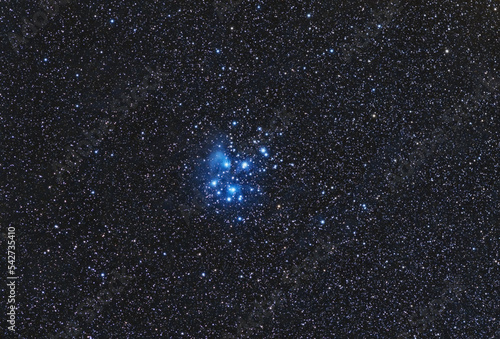 Wide field of the Pleiades, also known as The Seven Sisters and Messier 45, are an open star cluster containing the stars Sterope, Merope, Electra, Maia, Taygetas, Celaeno and Alcyone. 