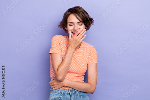 Closeup photo of young pretty cute nice woman wear pink t-shirt laughter comic joke good mood positive relax cover mouth isolated on purple color background