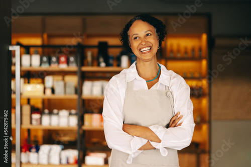 Successful small business owner smiling happily