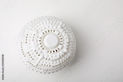 Laundry dryer ball on white table, top view. Space for text