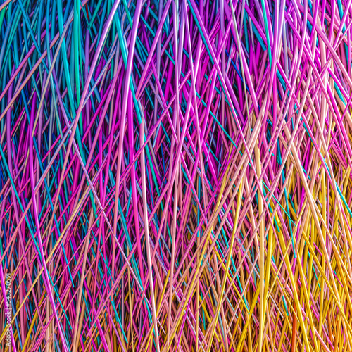 iridescent colored threads that intertwine.