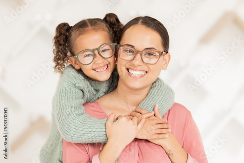 Eye care, glasses and child hug mother with new vision lens, prescription eyeglasses or ocular support spectacles. Eyesight, healthcare service and portrait of happy family at optometry retail store