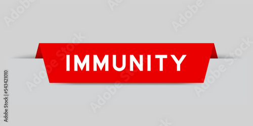 Red color inserted label with word immunity on gray background