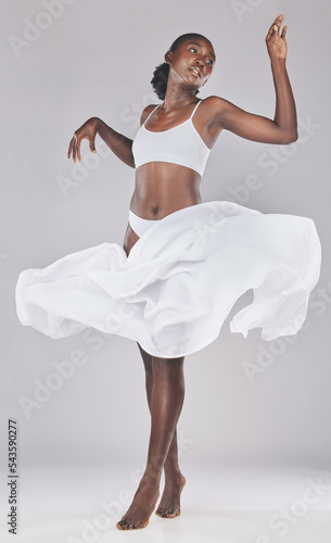 Woman, dance and art of a black woman looking elegant dancing with body health, wellness and beauty. Creative, dancer and healthy person from Africa with a fabric piece doing ballet or contemporary
