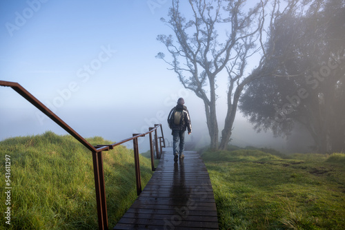 People walking in the fog, Mt Eden summit, Auckland.