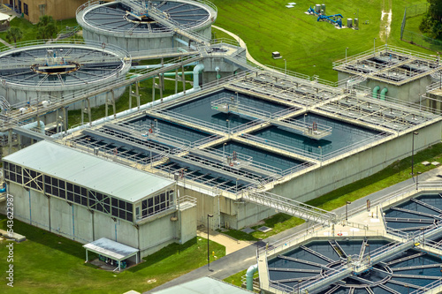 Aerial view of modern water cleaning facility at urban wastewater treatment plant. Purification process of removing undesirable chemicals, suspended solids and gases from contaminated liquid