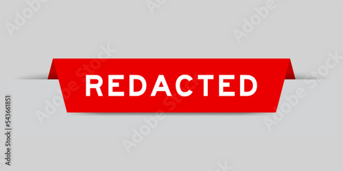 Red color inserted label with word redacted on gray background