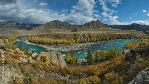 Russia. South of Western Siberia, the Altai Mountains. Picturesque high-altitude view in autumn colors of the Katun River near the village of Maly Yaloman.