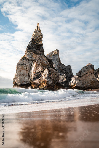 The beautiful rock formations of Praia Da Ursa at sunset, on the western coast of Portugal