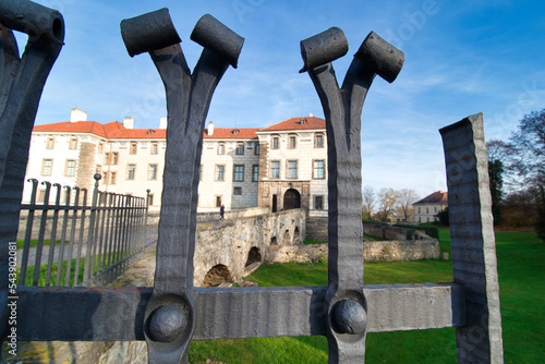 View over iron fence to Nelahozeves Chateau, finest Renaissance castle, Czech Republic.