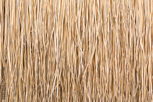 Close up of thatch roof or wall background. Tropical roofing on beach