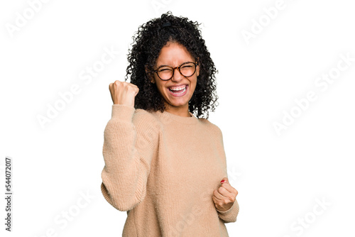 Young cute brazilian woman isolated cheering carefree and excited. Victory concept.