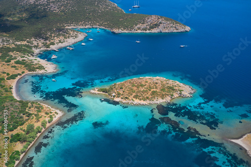 Aerial view of blue sea, islands, yachts along the mediterranean coast. Landscape of turkish riviera nature