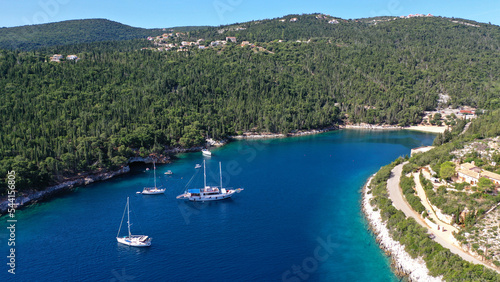 Aerial drone photo of beautiful bay and beach of Foki with iconic caves visited by yachts and sail boats, Kefalonia island, Ionian, Greece