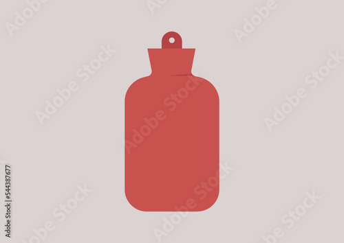 An isolated red rubber hot water bottle, bed warmer