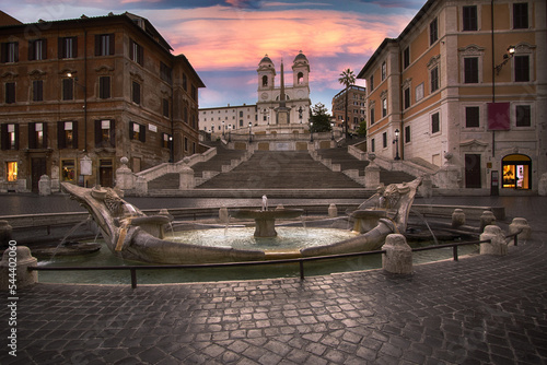 The Fontana della Barcaccia, at sunset, is a fountain found at the foot of the Spanish Steps in Rome's Piazza di Spagna (Spanish Square) created by Bernini. Rome Italy