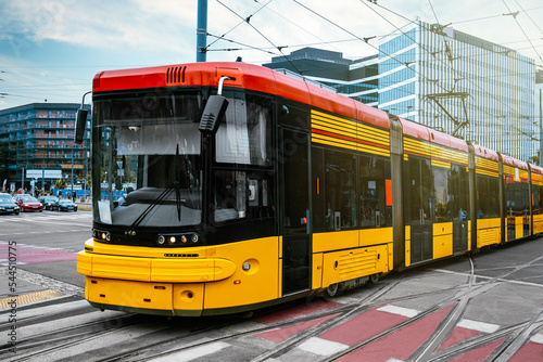 Modern tram on city street. Public transport