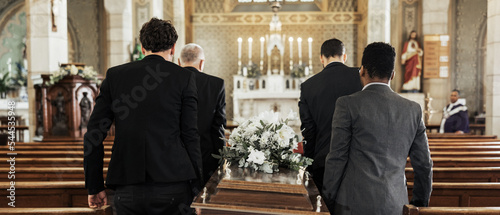 Funeral, church and group carry coffin in service, death or sermon for burial with support. Friends, family or pallbearers with casket for respect, help or sorrow in mourning, worship or god religion