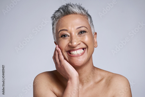 Botox, face and happy elderly woman for beauty skincare wellness and cosmetics plastic surgery model in studio. Portrait of black woman, skin health and natural dermatology care in grey background
