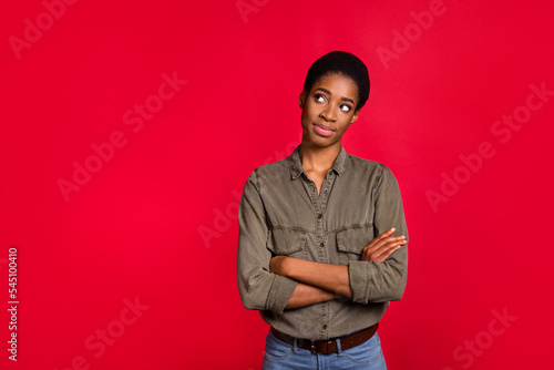 Photo of pensive androgyne lady cross arms look empty space wear smart casual shirt isolated bright color background