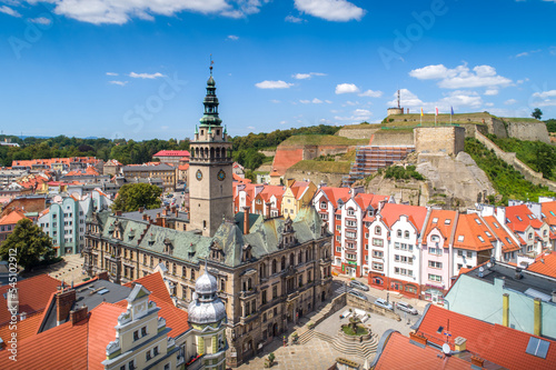 Kłodzko town hall aerial shot in autumn with Twierdza Klodzka in the background.