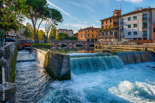 Evening view of the San Martino bridge. Italian city of Treviso in the province of Veneto. View of the river Sile and the architecture of the city of Treviso Italy. 