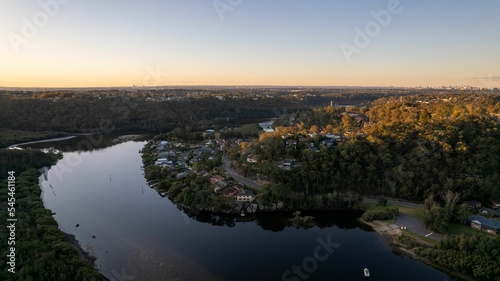 View of Woronora River surrounded by lush greenery at sunset in Sydney, New South Wales, Australia