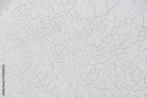 Cracked ceramic texture. Cracked white ceramic background.