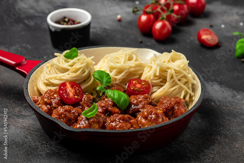 Pan with Italian pasta with tomato sauce and meatballs. Restaurant menu, dieting, cookbook recipe top view