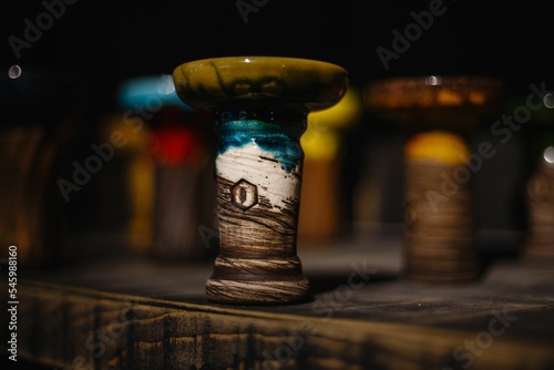 Closeup of a Kolos hookah bowl on a wooden table