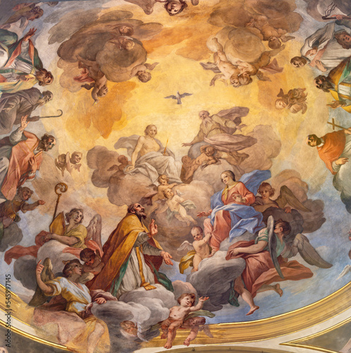 VARALLO, ITALY - JULY 17, 2022: The ceiling fresco Glory of Evangelists and St. Gaudentius in the church Collegiata di San Gaudenzio by Carlo Bartolomeo Borsetti (1702).
