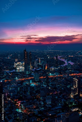 Vertical shot of the cityscape of Bangkok city in Thailand under the purple sunset sky