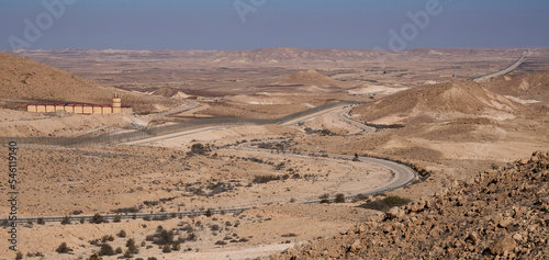 Restricted military zone along the border between Israel and Egypt along patrol road 10 in remote part of the Negev desert and the Sinai desert. The border barbed wire fence along the road 10.