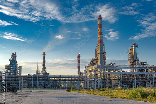 modern oil refinery against the background of the sky and clouds