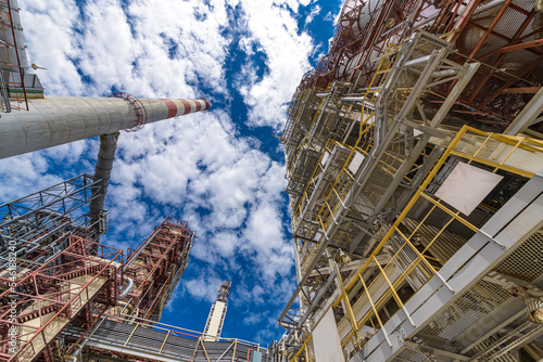 modern oil refinery against the background of the sky and clouds