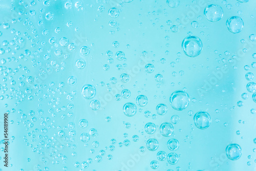 Bubbles in carbonated water. Background of water with bubbles closeup, soda. Refreshing cool drink.