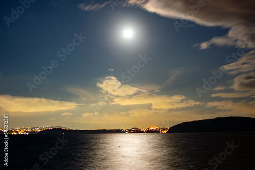 Night in Ischia Ponte with view on Gulf of Naples with moon