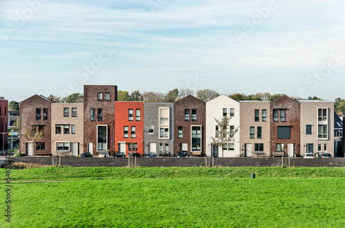 Zierikzee, The Netherlands, November 11, 2022: row of ten houses with varying colors and details to suggest individuality