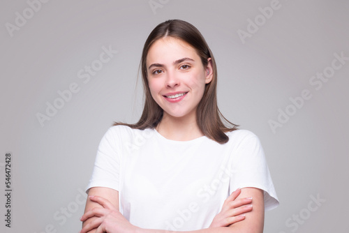 Happy smiling girl. Cheerful young beautiful girl smiling laughing, studio isoalted background. Beauty portrait of beautiful female model.