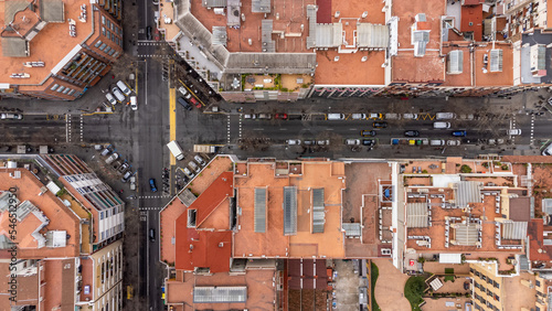 perpendicular view of the rooftops and street of the eixample district in barcelona