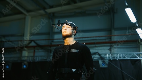 BTS Actor wearing motion capture suit acting as a game or animation movie character. Motion capture is an unparalleled method for making animated characters move more realistically