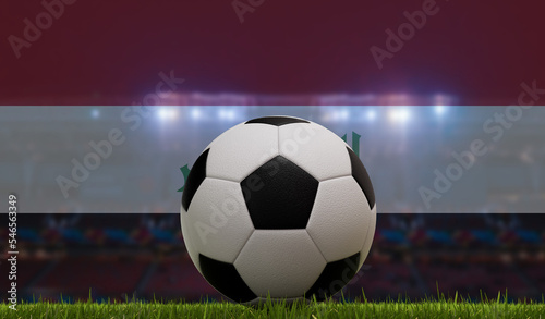 Soccer football ball on a grass pitch in front of stadium lights and iraq flag. 3D Rendering