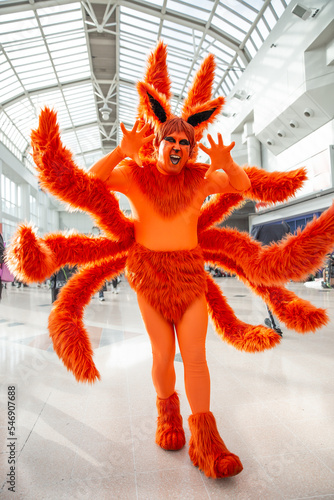 A colourful cosplayer dressed as a Japanese Anime monster