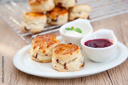 Cranberry scone set with raspberry jam and clotted cream