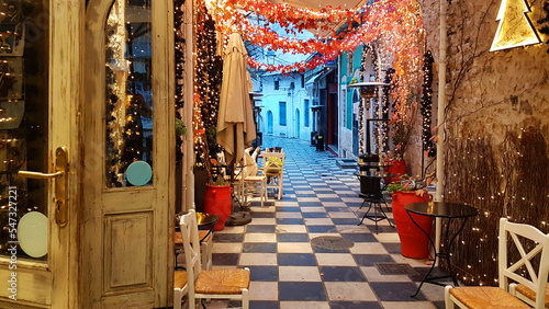 xmas season street cafe in ioannina city greece lights tables chairs pedestrian street like chessboard